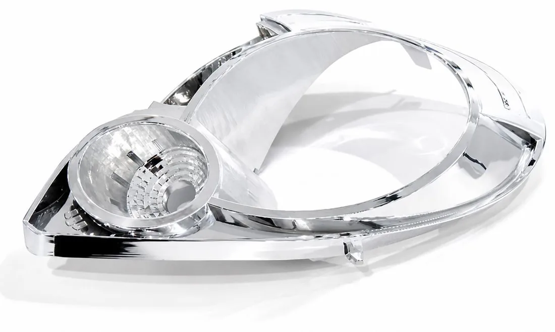 Automotive headlight assembly with aluminium vacuum metallized reflector and PC lens